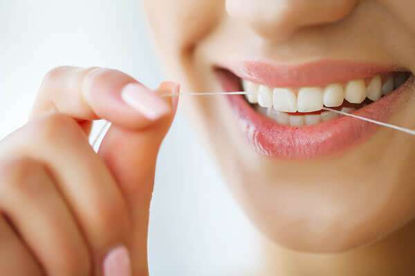 Ashburn Dentist - Flossing Teeth